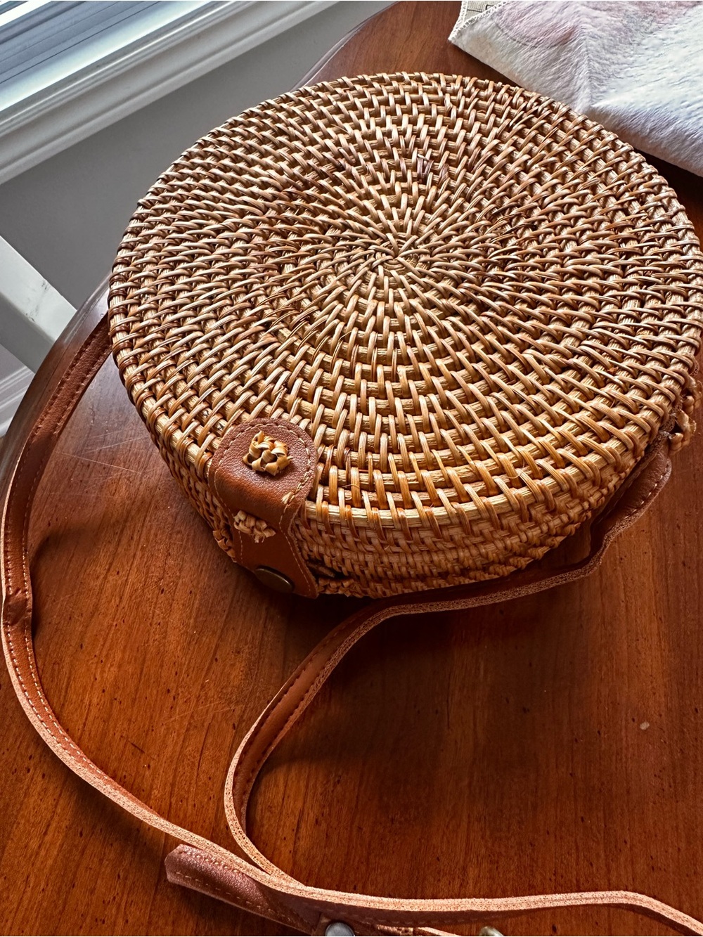 Round Woven Straw Crossbody Bag with Brown Leather Trim